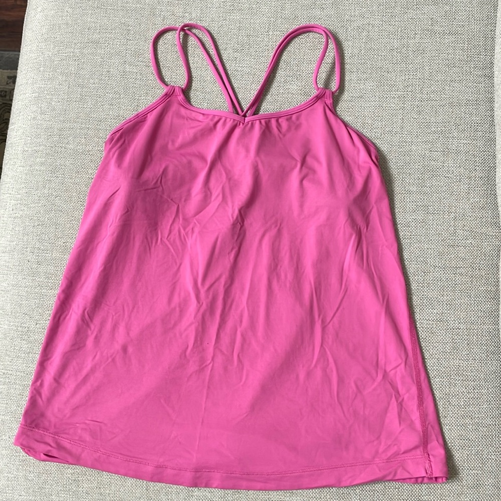 Lululemon pink strappy tank top with built in bra. Size women’s 6.